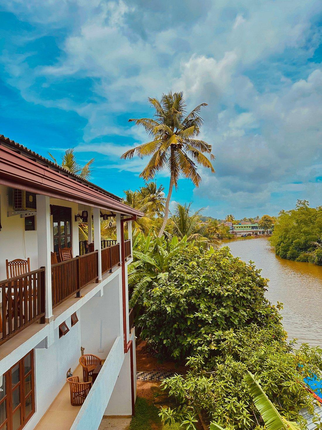 Riverwood Villa beside the river in daylight